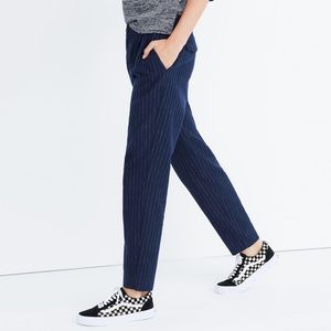 Madewell blue track trousers with white stripes.